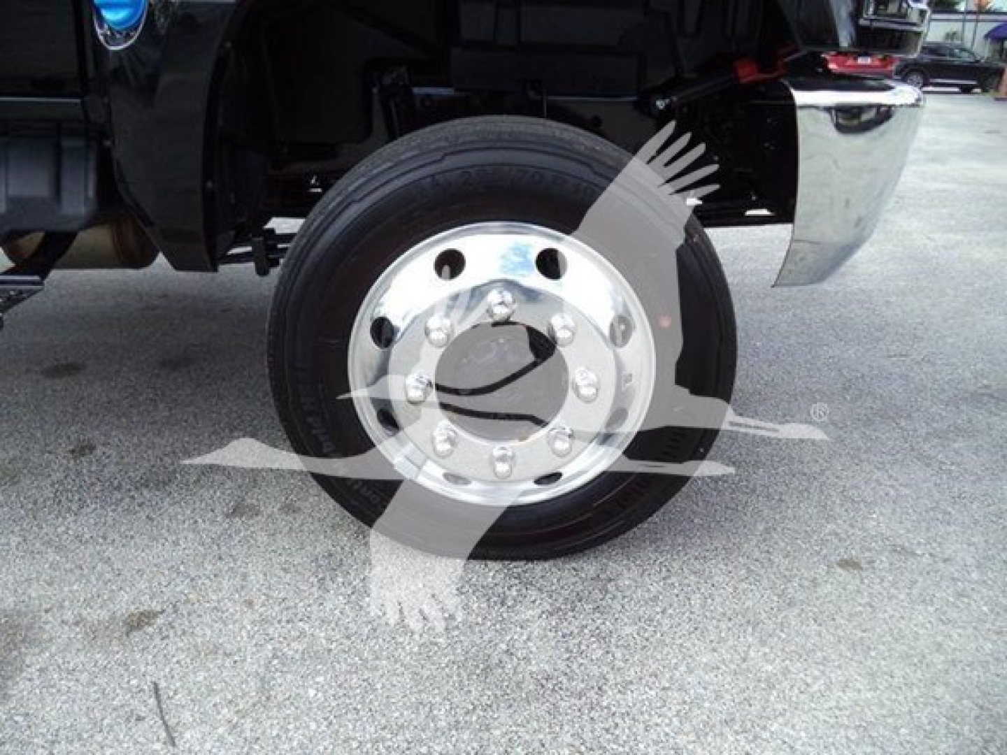Truck front wheel showing polished chrome hub and tire, part of International CV series.