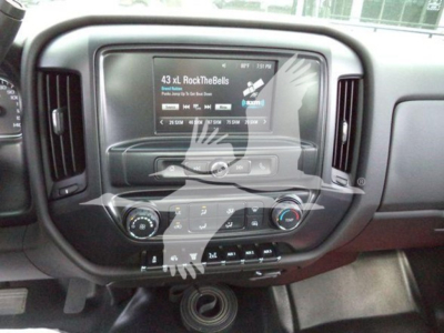 Dashboard of a 2023 International CV rollback truck showing infotainment screen with radio and climate controls.