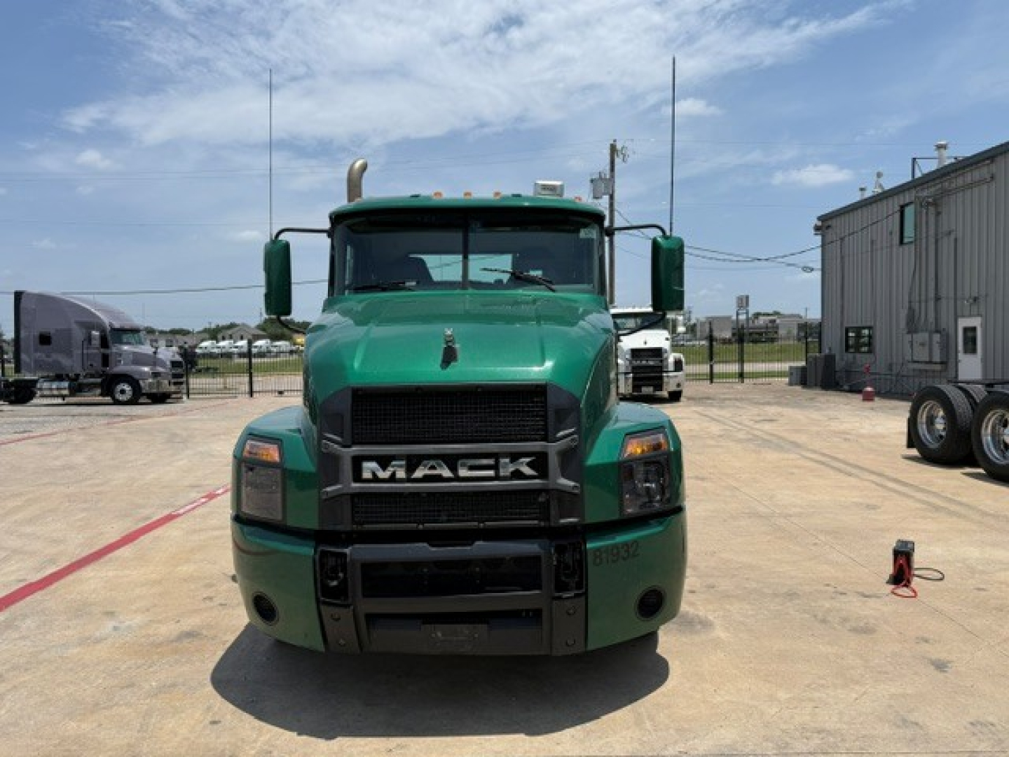 Mack ANTHEM 2019 conventional daycab truck front view showing green cab and large grille with MACK badge.