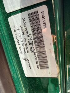 Mack ANTHEM truck label with VIN 1M1AN3GY0KM003172 and barcode sticker on green vehicle; stock number B3742L and MACK TRUCKS INC information visible.