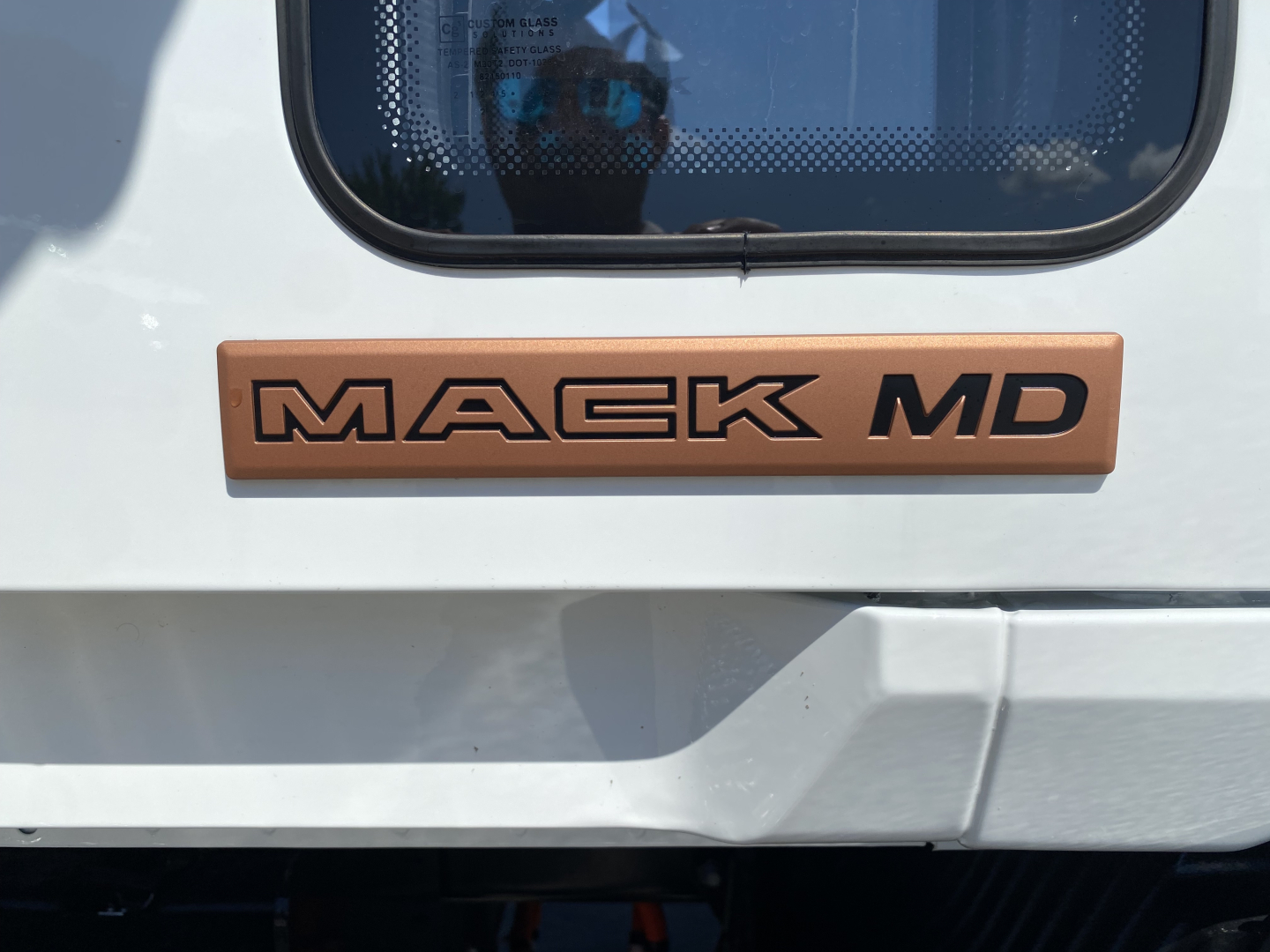 Mack MD badge on rear of truck showing clear 'MACK MD' lettering.