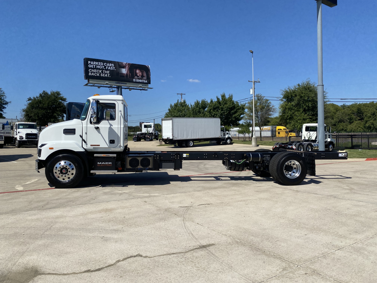Mack MD6 cab and chassis truck side view showing empty chassis with wheelbase and cab, VIN/stock details not visible on image.