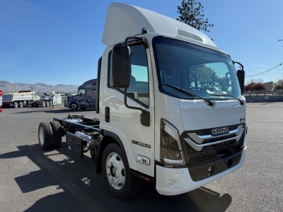 Isuzu NPRXD cab and chassis truck showing front and side view with raised roof, white color, Isuzu emblem on grille, chassis exposed rear wheels.