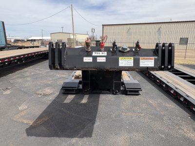 Front view of a Load King 9' 18'' lowboy trailer hitch assembly with safety decals and hooks visible.