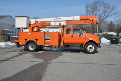 Orange Ford F-750 bucket truck with Terex lift arm extended, side view showing utility compartments and chassis.