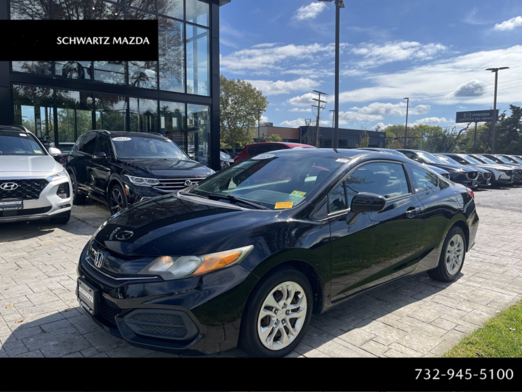 Honda Civic Coupe 2015 dark blue/black exterior parked at dealership lot with other vehicles in background.