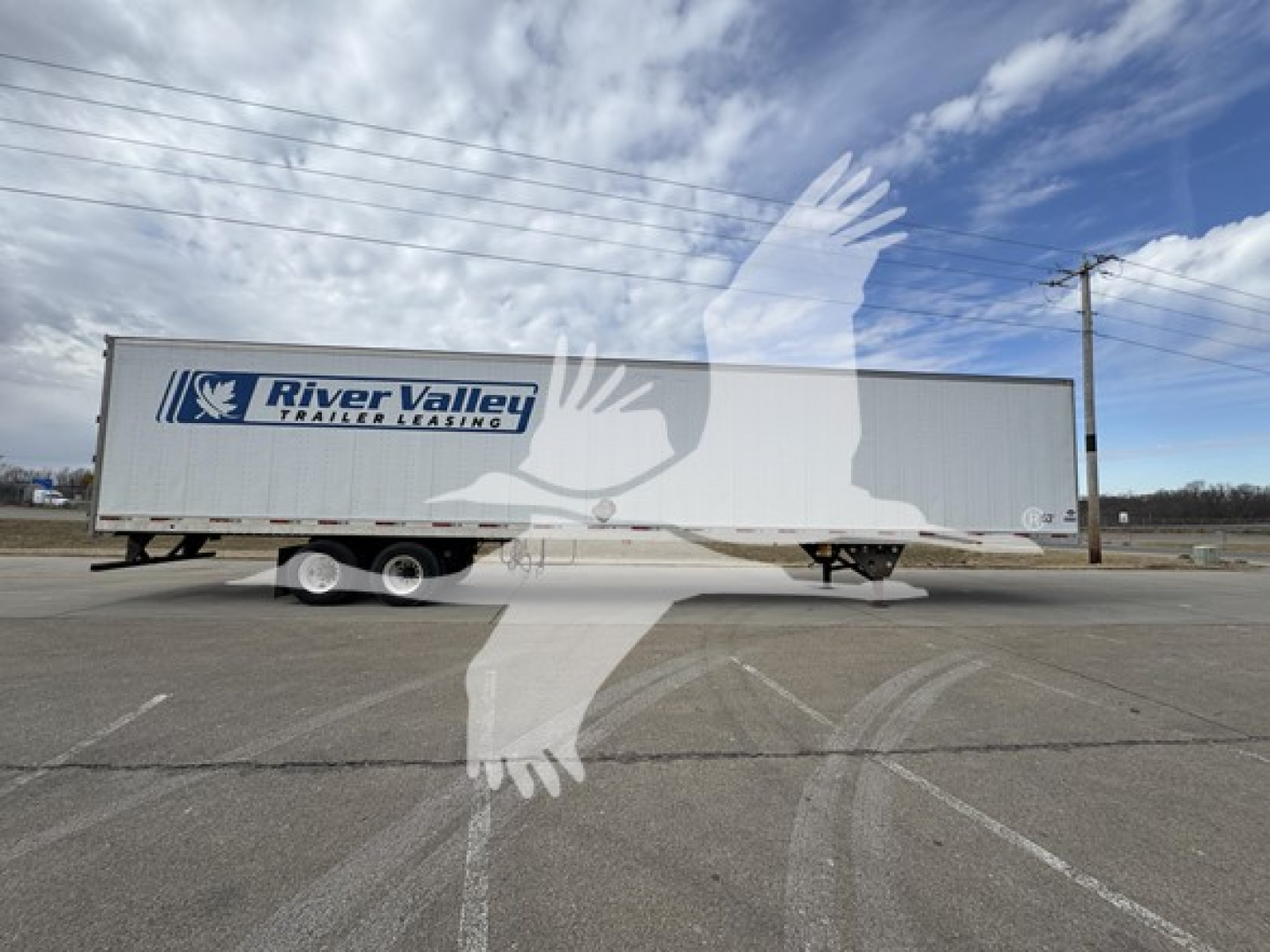 Utility 4000Dx trailer in lot with River Valley Trailers Leasing logo on side.