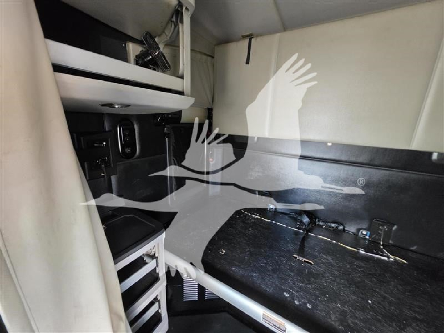 Kenworth T680 cab interior showing storage compartments and a work surface in dash area