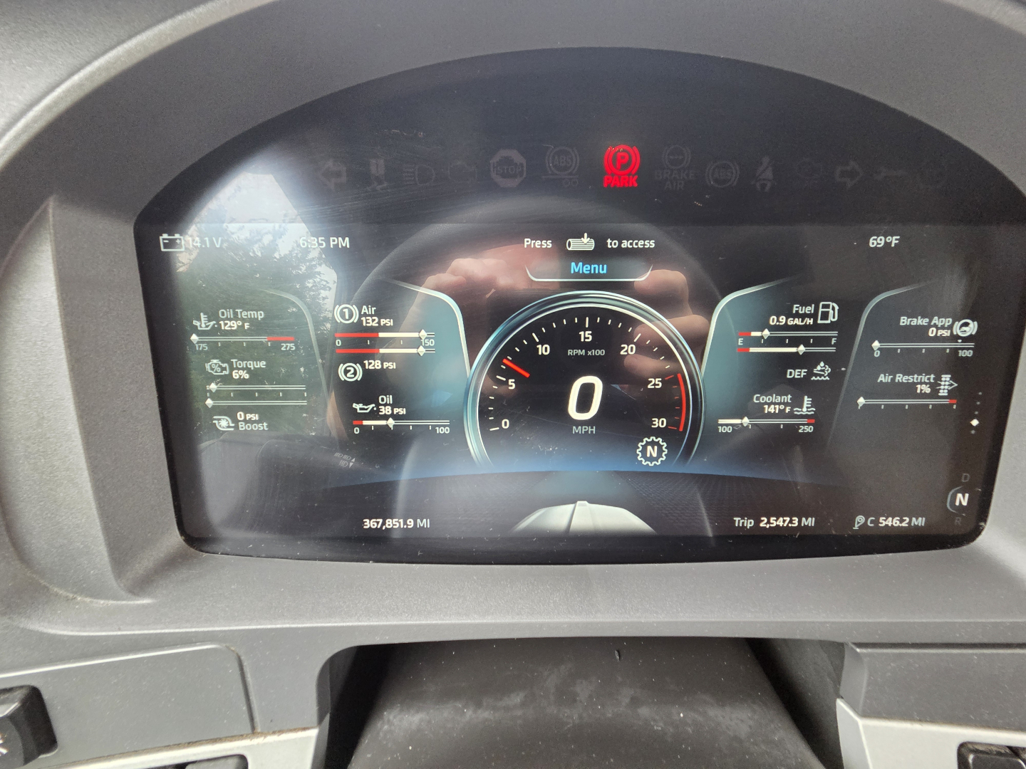Kenworth T680 dashboard display showing digital gauges and warning icons.