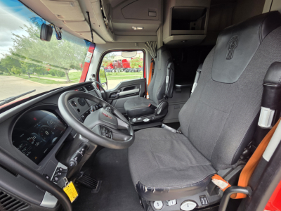 Kenworth T680 truck interior with driver seat and dashboard visible