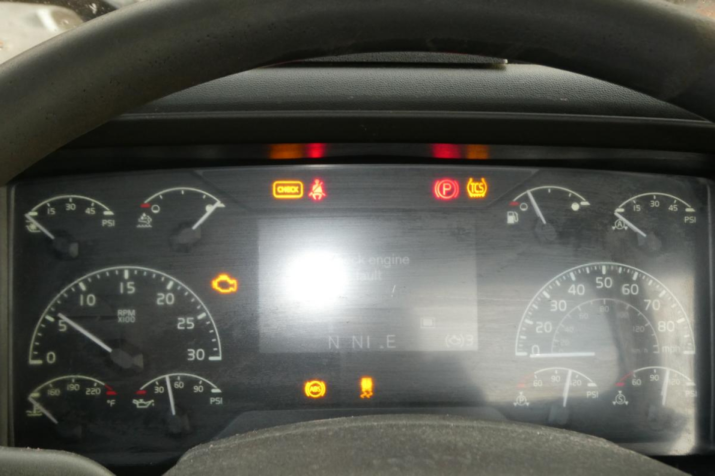 Dashboard of a 2019 Volvo VNR64T300 truck showing instrument cluster and warning lights.