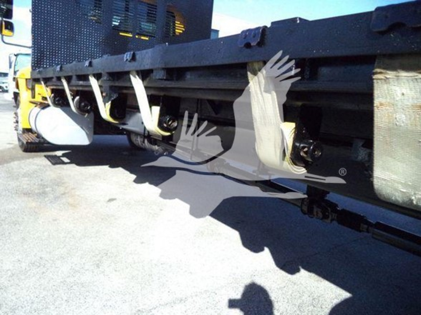 Flatbed truck undercarriage showing mounting brackets and frame components of a 2019 International Durastar 4300.