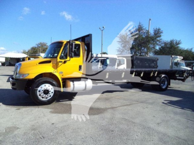 2019 International Durastar 4300 flatbed truck side view showing yellow cab and white flatbed, VIN 1HTMMMML1KH584272, stock T84272.
