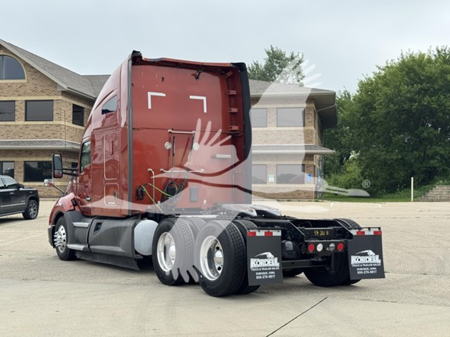 Kenworth T680 tractor rear view showing dual rear axles and red sleeper cab