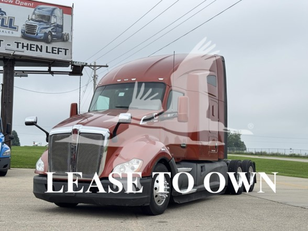 Kenworth T680 semi-truck tractor in red, front view, with cab and grille visible; text overlay 'LEASE TO OWN' across image.