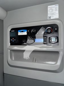 Dashboard panel in Kenworth T680 cab showing various controls and a digital display.