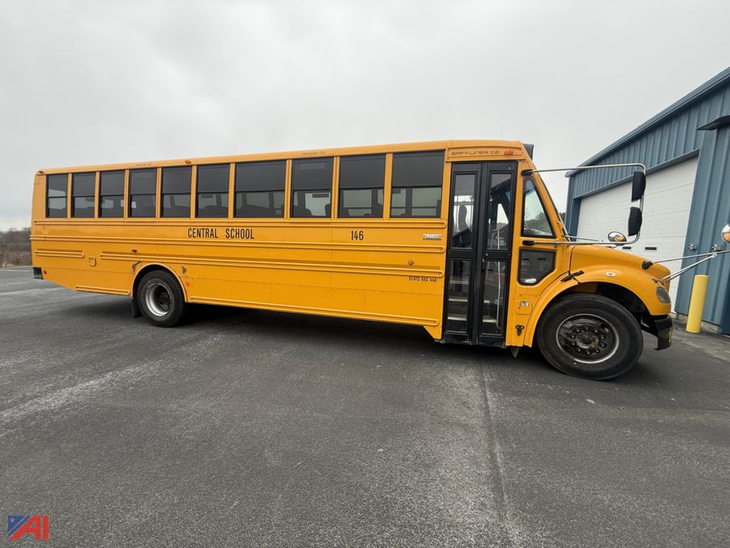 Yellow Freightliner school bus side view showing Central School 146 and open front door