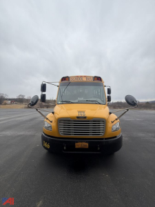 Front view of a yellow 2015 Freightliner B2 school bus with a 'SCHOOL BUS' sign, large grille, side mirrors, and bus number 146 on the hood.