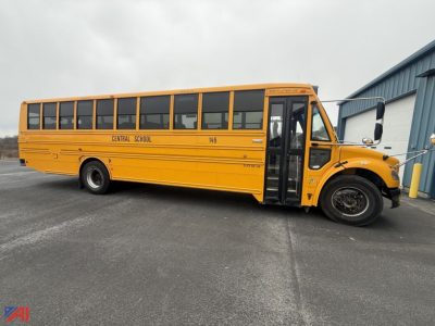 Yellow Freightliner school bus side view showing Central School 146 and open front door