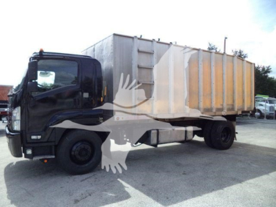 Isuzu FTR truck with dump body in service side view showing cab and long rear dump bed.