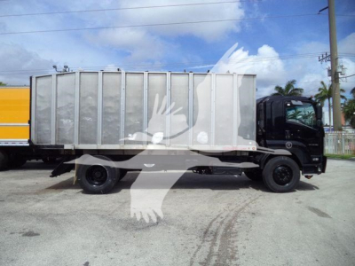 Isuzu truck with a large metal dump body, side view, black cab, yellow cargo container behind, in a parking lot.