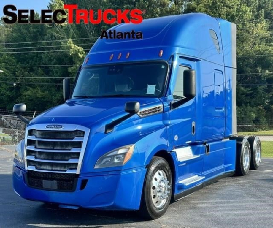 Freightliner Cascadia 126 blue truck cab in view with logo SelectTrucks Atlanta.