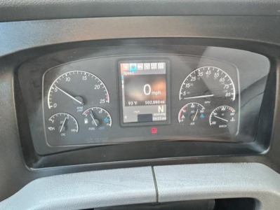 Freightliner Cascadia dash cluster showing speedometer at 0 mph on center display; gauges for fuel and air pressure around; VIN/stock info not visible on dash.