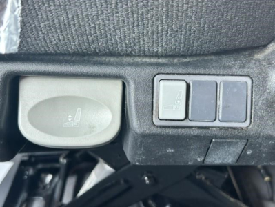 Freightliner Cascadia dash area showing control stalk and switch panel near steering column.