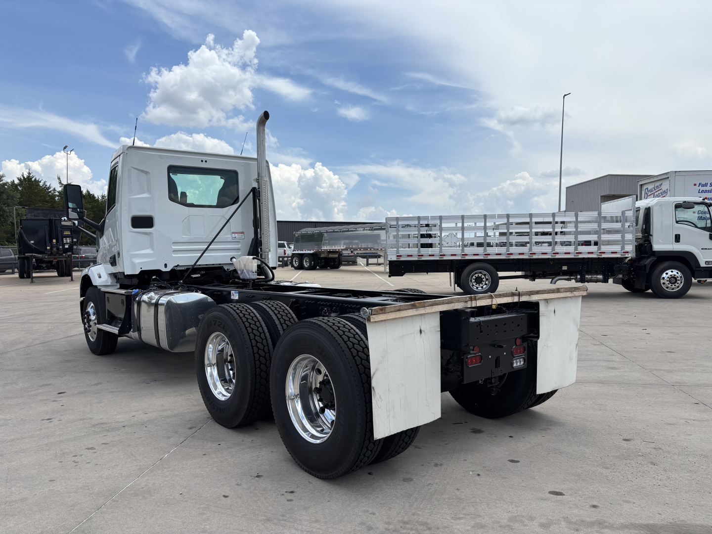 Mack AN64 chassis with cab and rear dual-axle configuration, flatbed/tongue area visible, white cab, stock number 72794, VIN 1M2A24GC0VM103467.