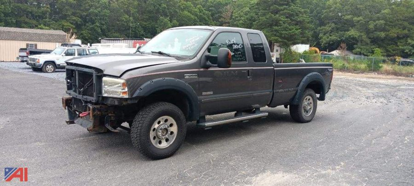Ford F-250 Super Duty pickup with extended cab and single rear wheel showing front bumper winch mounting plate and side step