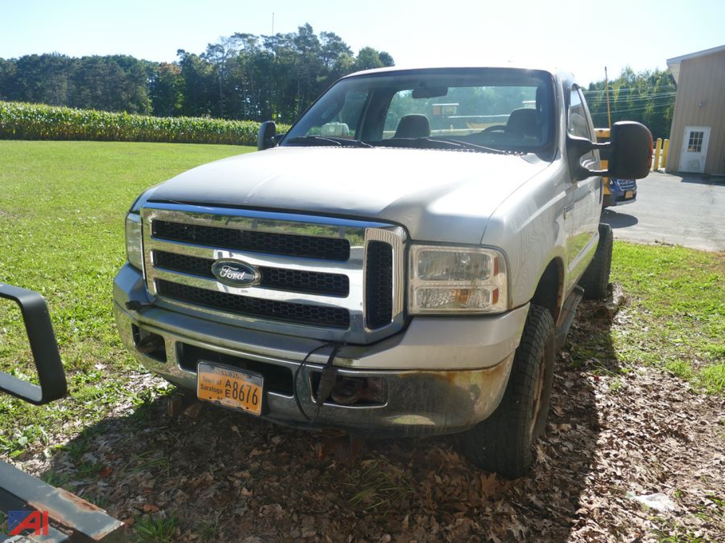 Ford F-350 Super Duty pickup front view showing chrome grille, headlights, and yellow license plate.