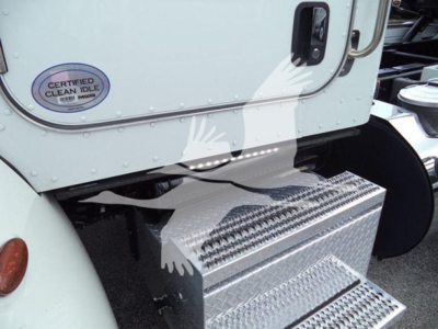Peterbilt 337 rollback showing aluminum step with diamond tread and sticker on cab door