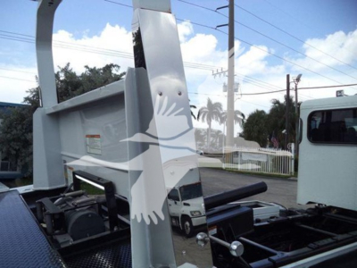 Peterbilt 337 rollback truck chassis showing rear bed and hydraulic components with VIN and stock labels not visible on the side.