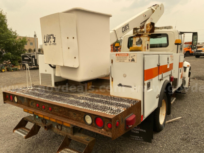 Tow truck with bucket lift, rear platform and controls; visible labels include 'CLCIER' on boom and small warning signs; diamond orange stripe on white body; metal diamond plate deck.