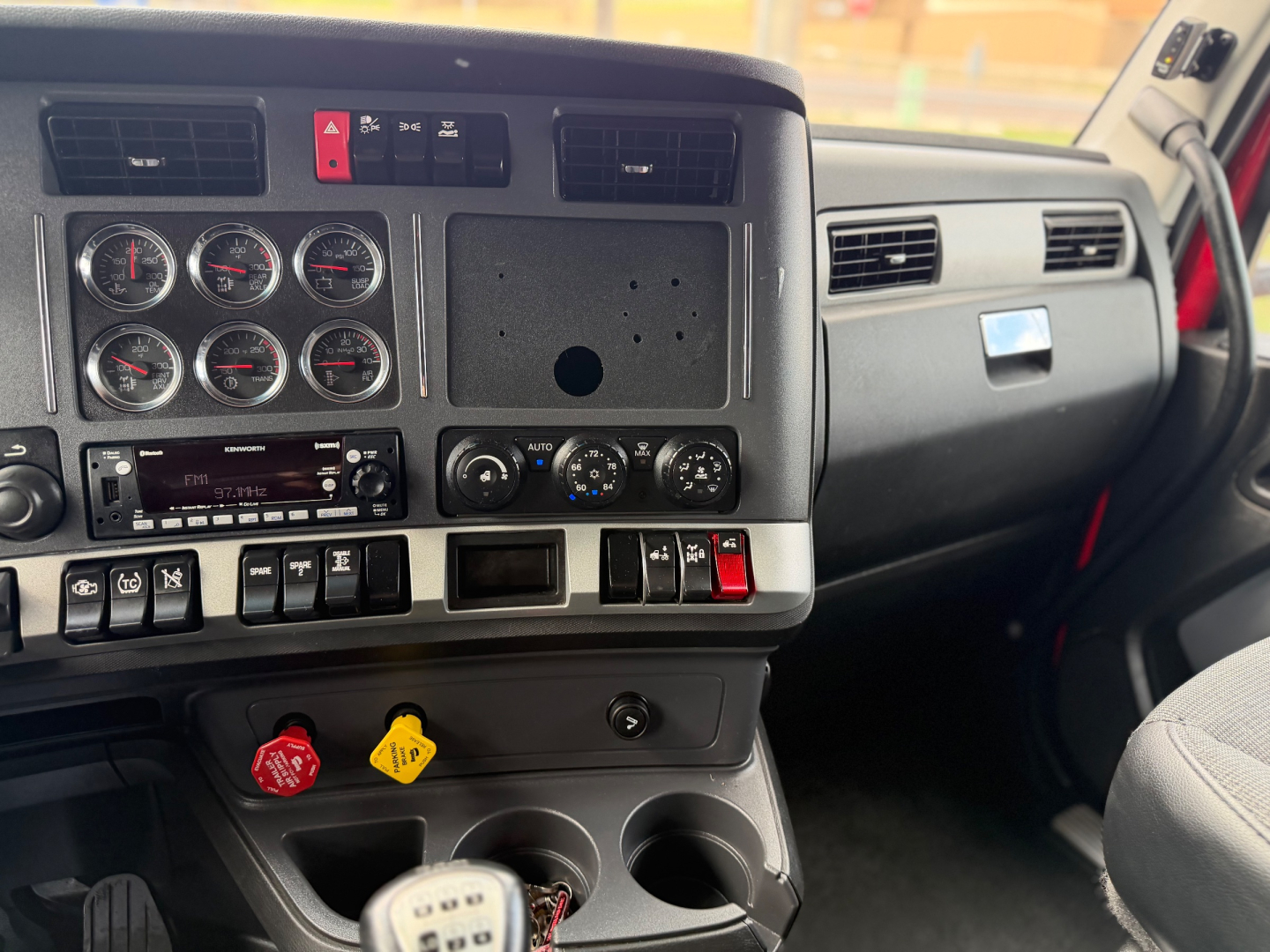Kenworth T680 dashboard and center console with gauges and controls visible