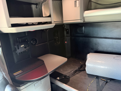 Kenworth T680 truck cab interior showing sleeper area and storage compartments.