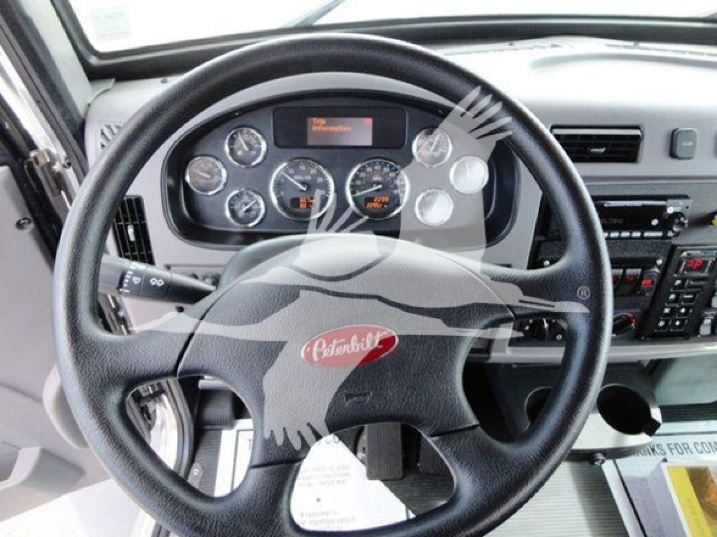 Peterbilt 337 cab interior showing steering wheel and dashboard instruments