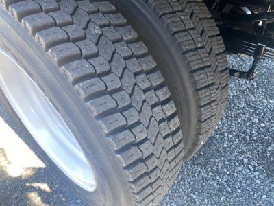 Ford F-550 dual rear wheels showing heavy tread tires and wheel rims.