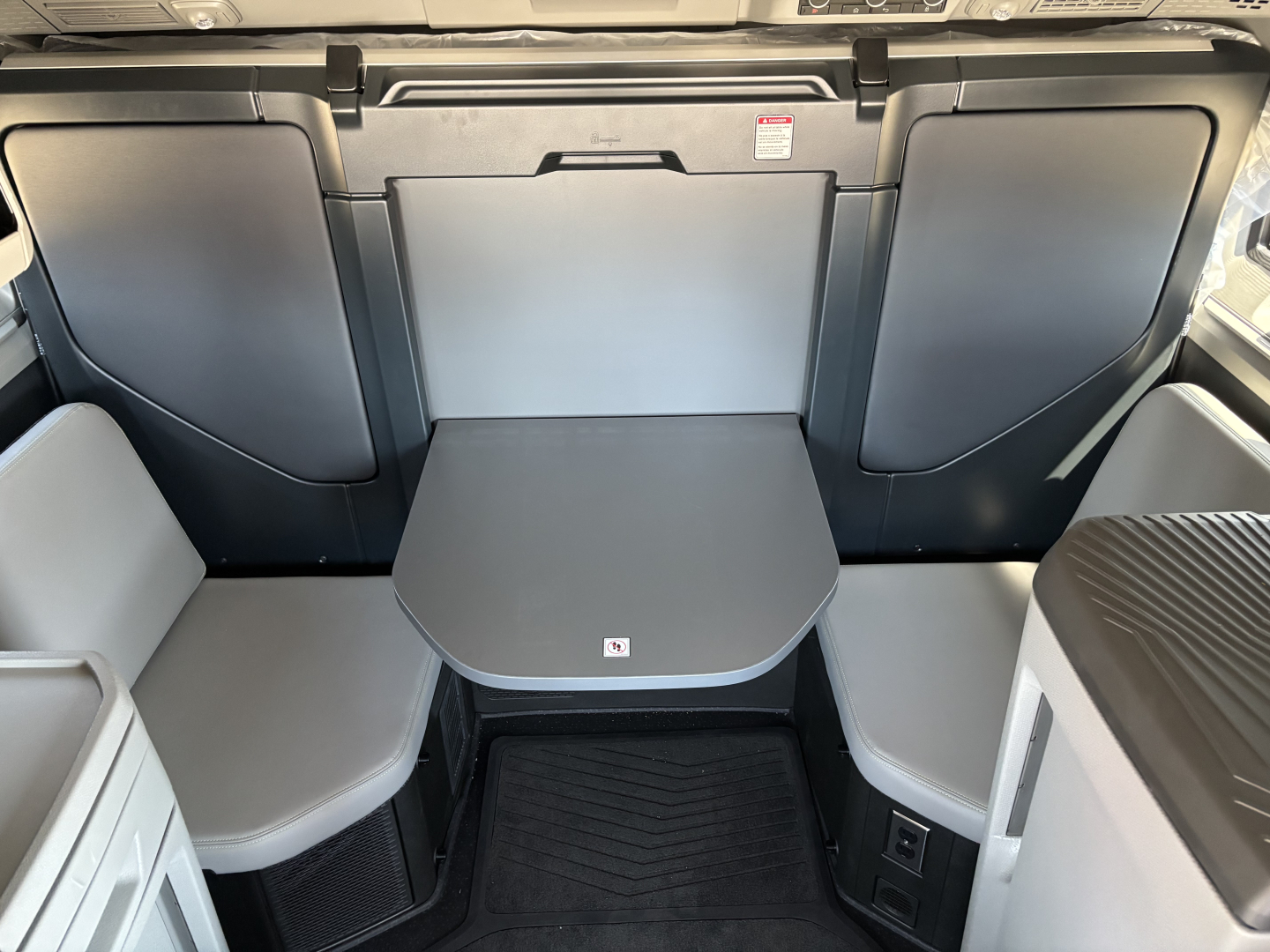 Volvo VNL64T860 sleeper cab interior showing table and seating area