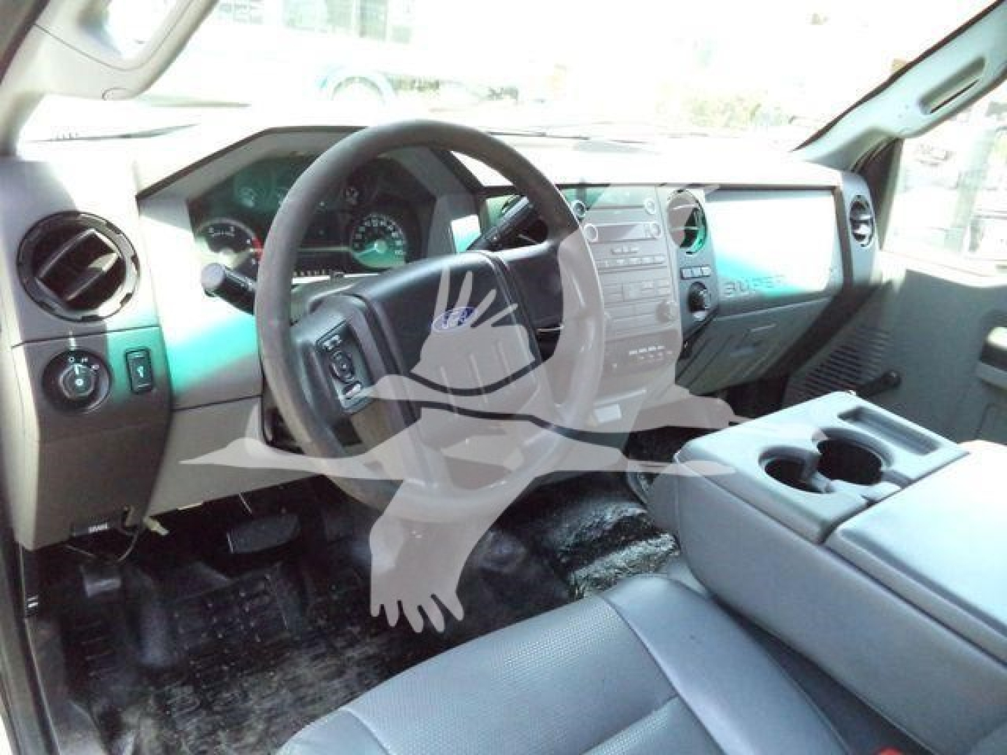 Ford F-550 interior dashboard steering wheel and center console visible, front seats, driver area