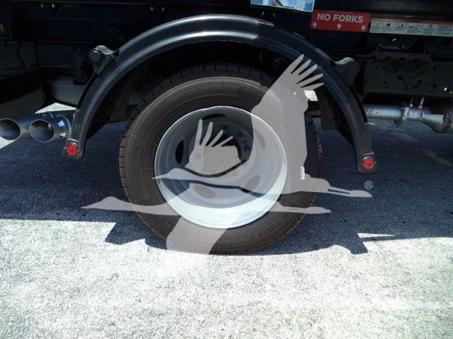 Ford F550 wheel and rear fender area showing tire and fender arch.