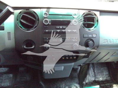Ford F-550 interior dashboard view showing center console and climate controls.