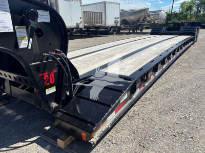Fontaine Renegade N20 lowboy trailer showing landing gear and side deck with 'Fontaine Renegade 20' label and equipment hoses near front corner.