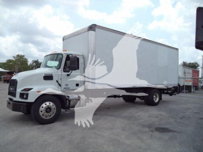 Box truck with cargo trailer and white cab in a parking lot showing Mack MD7 branding and a large box trailer.