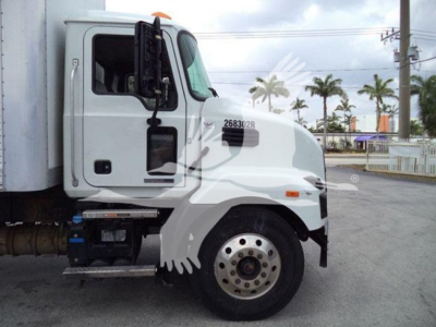Mack MD7 day cab truck in-side view showing front fender, front wheel, and door with stock number 268302R and VIN plate area.