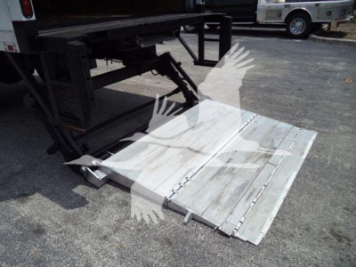 Truck rear view showing aluminum loading ramp deployed from a Mack MD7 box truck.