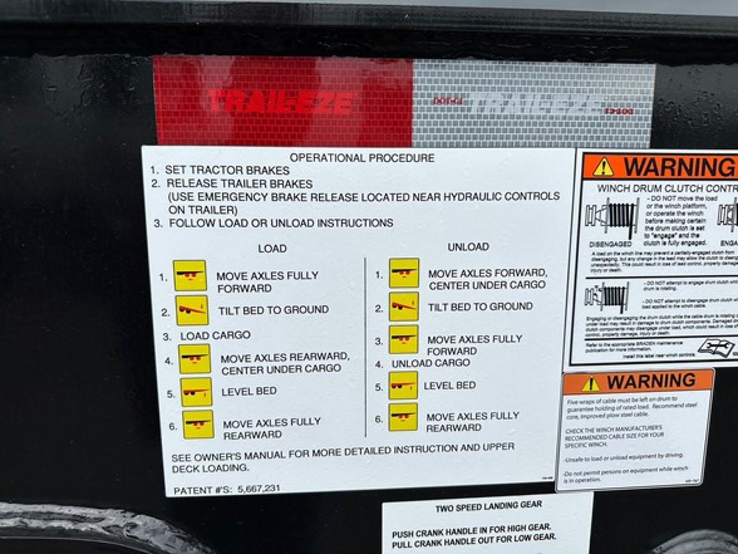 Trailer label showing operational procedure with load/unload steps and warnings for Trail-Eze TE801 trailer, including diagrams and text blocks.