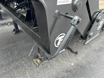 TE801 trailer hitch arm and frame with hydraulic or mechanical support leg visible, black metal components and protective coating.