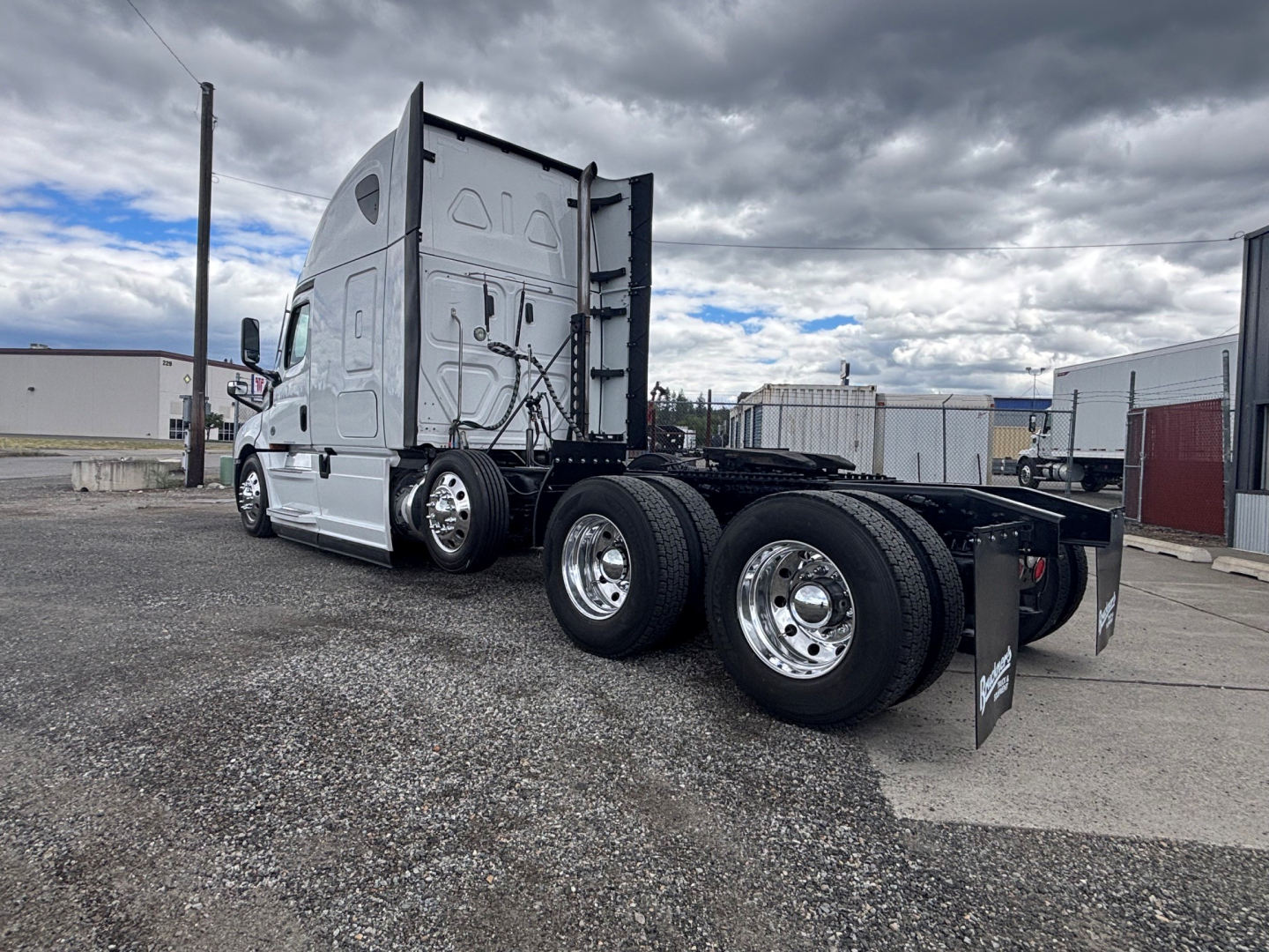 Freightliner CA-126 conventional sleeper tractor showing chassis and wheel configuration with dual rear axles and fifth-wheel area.