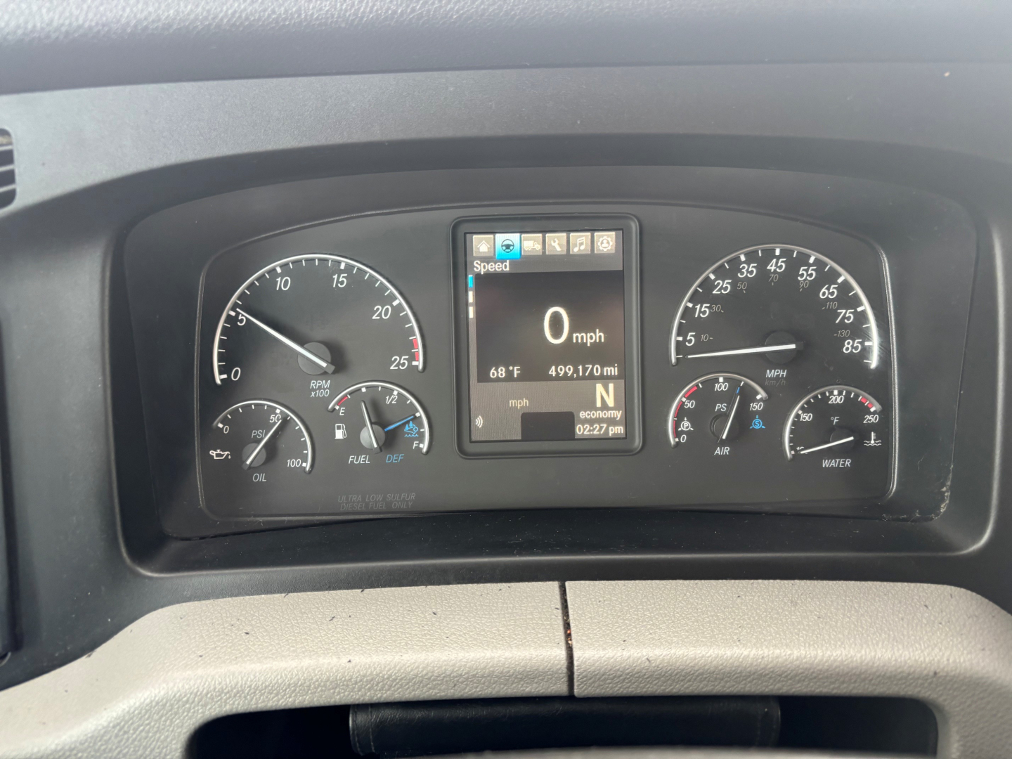 Dashboard of a Freightliner CA-126 showing instrument cluster with speedometer, tachometer, and central display reading 0 mph, N gear, 68°F, 499,170 mi.